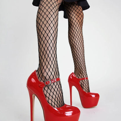 Fishnet stockings with black garter strap and glossy red platform stilettos