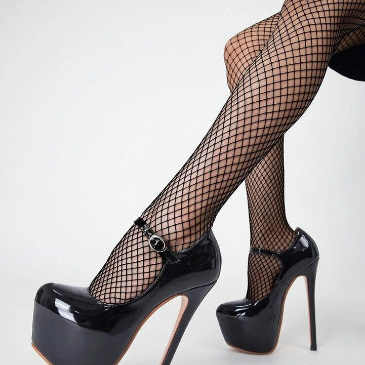 Fishnet stockings with black ankle strap and black platform stilettos